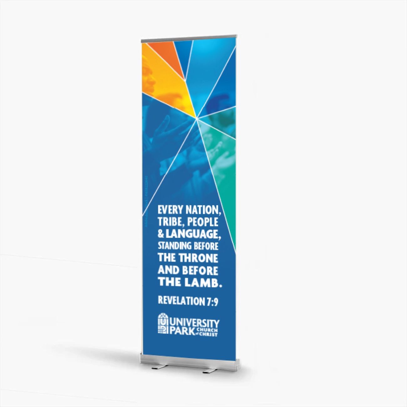 Retractable banner stand showing a stained-glass starburst over congregation photography with Revelation 7:9.